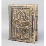 The National Family Bible, leather and gilt bound (slight damage to the edge of the back)