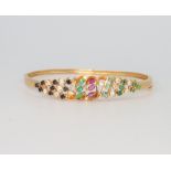 An 18ct yellow gold gem set bangle, 11.4 grams