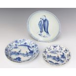 An 18th Century Chinese blue and white dish decorated with a lady sitting beneath bamboo 17cm, 2