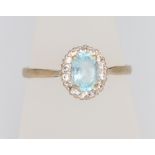 A 9ct yellow gold aquamarine and diamond cluster ring size R, 2.1 grams