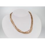 A 9ct yellow gold muff chain 16.8 grams, 138cm