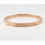 A 9ct yellow gold engine turned bangle, 10.5 grams