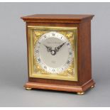 Elliott for Mappin & Webb, a mantel timepiece with silvered dial, gilt spandrels and Roman numerals,