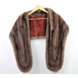 A mink stole complete with receipt of sale
