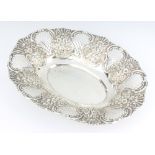An Edwardian pierced and repousse silver oval dish decorated with flowers, Chester 1903, 32cm, 314