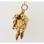A 14ct yellow gold cuckoo clock pendant and chain, 4.1 grams
