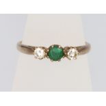 A 9ct yellow gold emerald and diamond 3 stone ring, size O, 2.1 grams