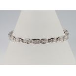 An 18ct white gold princess cut diamond tennis bracelet, 4ct