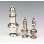 A Queen Anne style silver sugar shaker Chester 1926 17cm and a pair of silver octagonal condiments