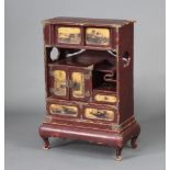 A 19th Century Chinese red lacquered table top cabinet fitted recesses, cupboards and drawers,