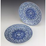 A pair of 18th Century Chinese shallow dishes decorated with panels of flowers 27.5cm Both plates