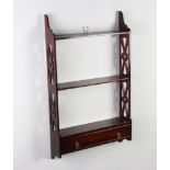 A Chippendale style mahogany hanging 3 tier wall shelf, the base fitted a drawer and with pierced