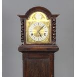 An 8 day striking longcase clock with 19cm arched gilt dial and silvered chapter ring, contained