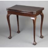 A Georgian style card table of serpentine outline raised on cabriole ball and claw supports 76cm h x