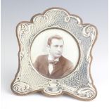 An Edwardian repousse silver photograph frame Chester 1905, 16.5cm There are several holes to the