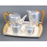 A Picquot ware 5 piece tea service comprising twin handled tea tray, hot water jug, cream jug,