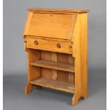 A student's Art Nouveau light oak bureau, the fall front above a drawer, the base fitted 2 shelves