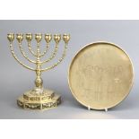 A brass Menorah raised on a stepped octagonal base 27cm x 15cm and a circular Chinese gilt metal