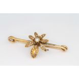 A 9ct yellow gold pearl set floral bar brooch, 3.4 grams