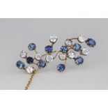 A yellow gold sapphire and gem set spray brooch 55mm, contained in original box