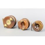 Three 19th Century brass and wooden centre pin fishing reels 10cm, 7cm and 6.5cm