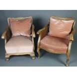 A 1950's bleached mahogany Georgian style show frame single cane bergere armchair with carved