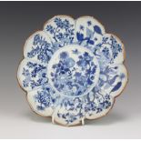 A 19th Century Chinese lobed dish decorated with panels of flowers 32cm