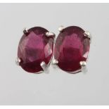 A pair of treated ruby ear studs