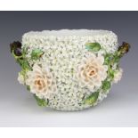 A 19th Century jardiniere encrusted with flower heads and rustic handles 17cm There are minor