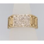 A gentleman's 9ct yellow gold diamond set key pattern ring, size P, 4.8 grams