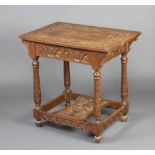 A Victorian rectangular heavily carved oak centre table with apron, raised on turned supports with