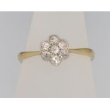 An 18ct yellow gold diamond cluster ring size M 1/2