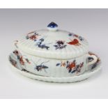 A 19th Century Chinese oval 2 handled box and cover decorated with crickets, butterflies and flowers