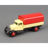 Dinky a 1948/50 covered wagon (25b) with cream body, black moulded chassis, red cover and red hubs