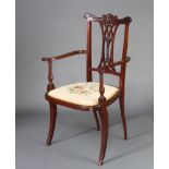 An Edwardian inlaid mahogany pierced vase shaped slat back open armchair with Berlin wool work seat,