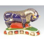 A Royal Crown Derby Imari pattern paperweight in the form of a bull with silver stopper 19cm