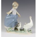 A Lladro group of girl following a family of geese 5503 19cm