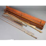A Farlows 3 section fly fishing rod with timber let in, in cloth bag, a bamboo 3 section fishing rod