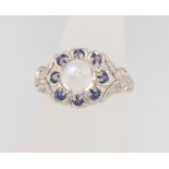 A 9ct white gold moonstone and gem set ring size O 1/2