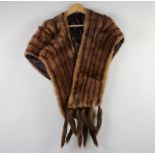 A lady's mink stole, some molt,