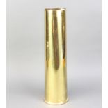 A brass shell case 49cm x 11cm