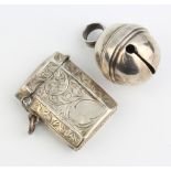 An Edwardian octagonal chased silver vesta, Chester 1908 and a silver bell Birmingham 1931