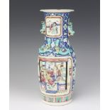 A 19th Century Chinese famille rose vase decorated with painted panels of flowers with pavilion in
