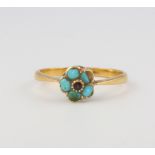 An 18ct yellow gold ruby and turquoise cluster ring size L 1/2, 2.1 grams