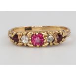 An 18ct yellow gold ruby and diamond ring, size K, 2.7 grams
