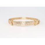 An 18ct yellow gold diamond set bangle, approx 1.5ct