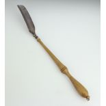 A silver shoe horn with turned wood handle 53cm