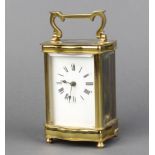 20th Century French carriage timepiece with enamelled dial and Roman numerals contained in a gilt