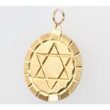 A 9ct yellow gold Star of David pendant 4.1 grams