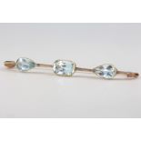 A 9ct yellow gold 3 stone aquamarine bar brooch 58mm